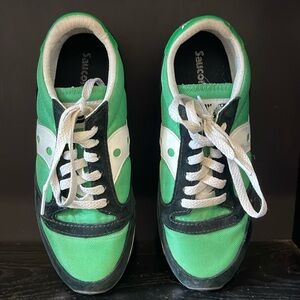 Green and Black Saucony tennis shoes